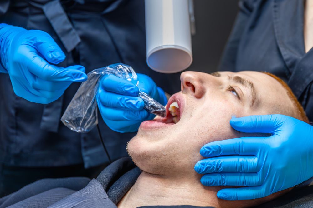 a man is getting dental treatment