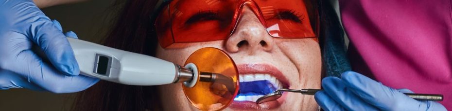 a woman is getting dental treatment