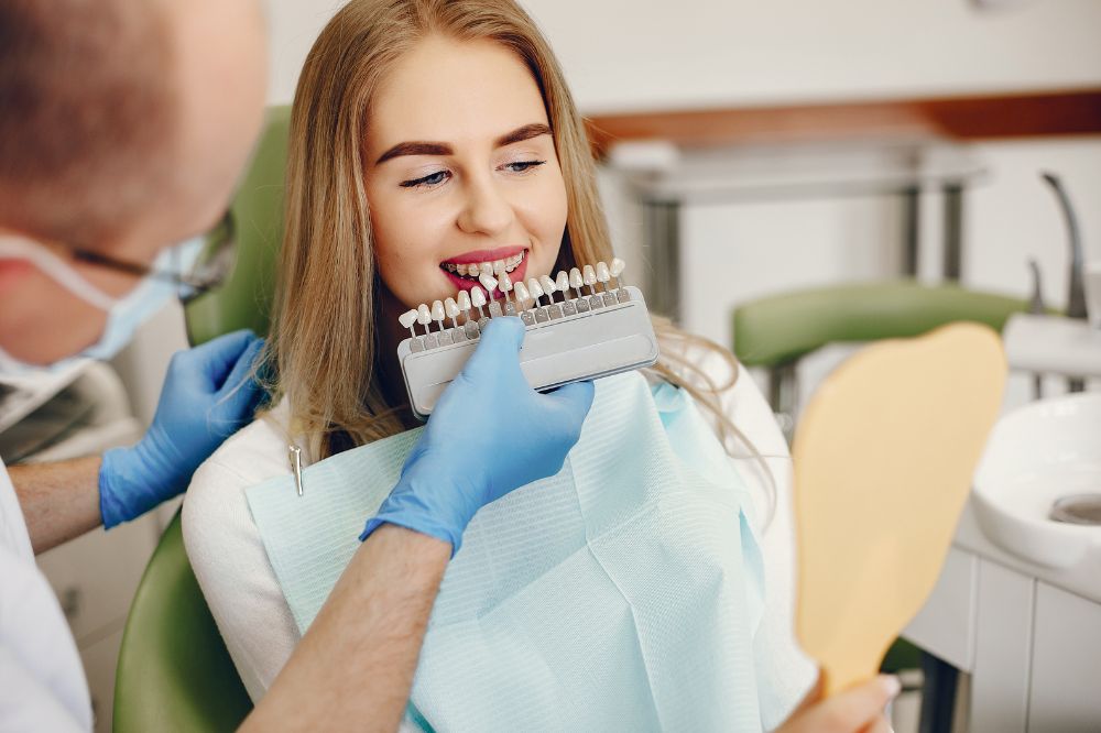 a woman is getting dental treatment
