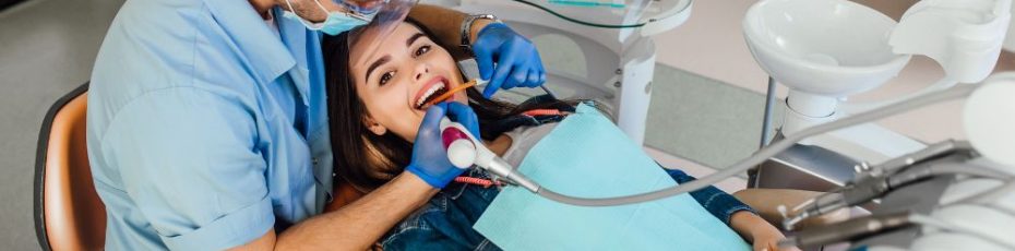 a woman is getting dental treatment
