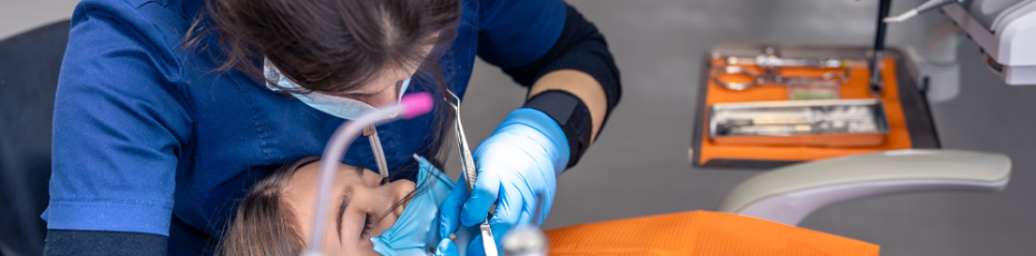 a woman is getting dental treatment