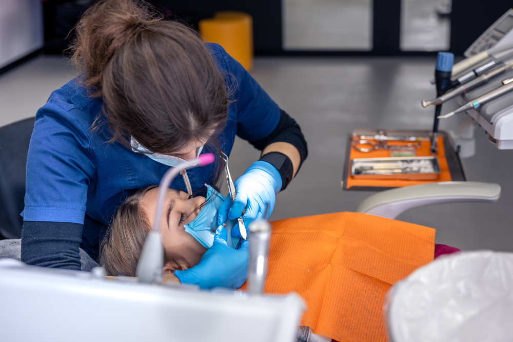 a woman is getting dental treatment